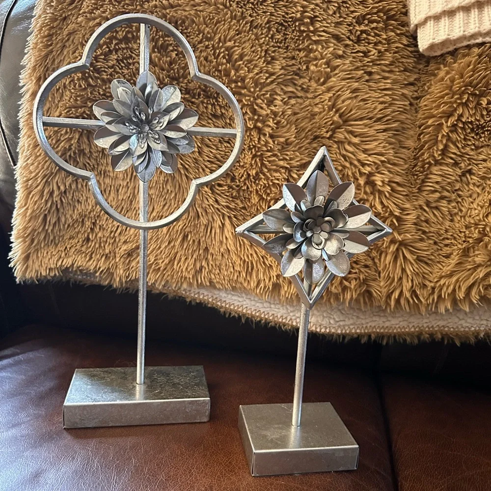 Home decor accents  two silver flowers on pedestal stand